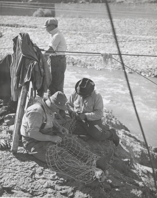 Indian fishermen repairing their nets