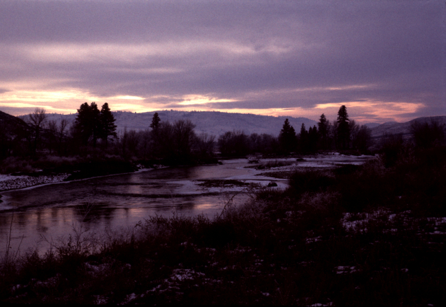 A winter sun setting over salmon streams of the Pacific Northwest