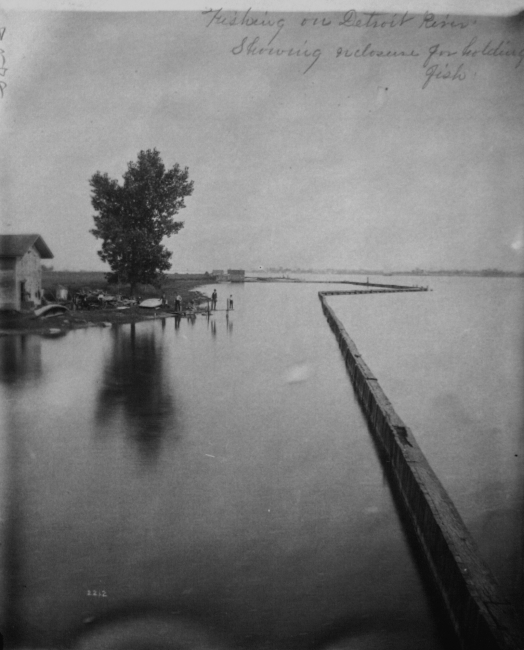 Fishing on Detroit River, MI, showing enclosure for holding fish