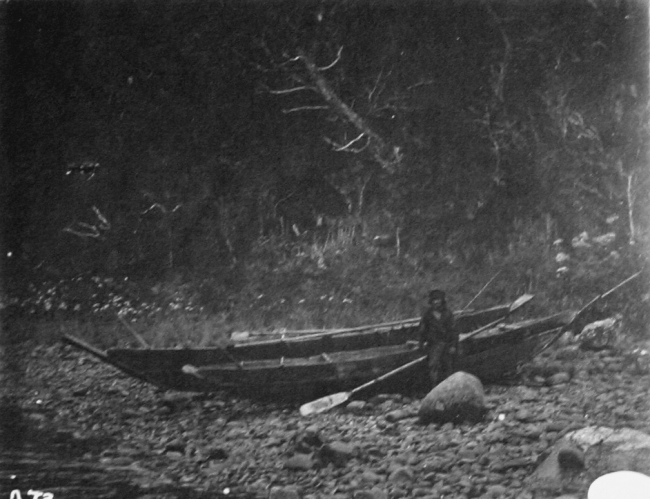 Fuegian and canoe, Otter Bay, Smythe Channel, Western Patagonia
