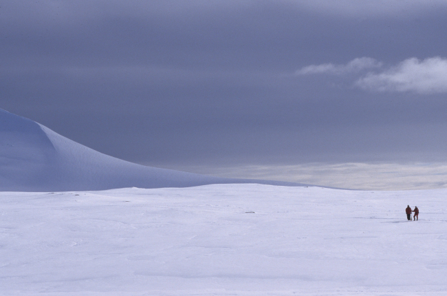 Scientists on a trek across the ice and snow give scale to an Antarcticlandscape
