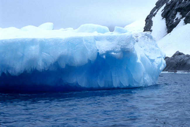 A tabular iceberg, fractured and sculpted by wind and ice