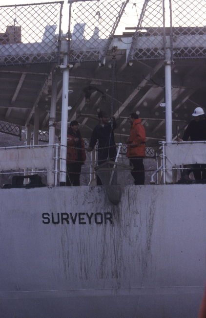 Scientists lower a small net off the back of the R/V Surveyor, used by the AMLRfrom 1987 to 1995