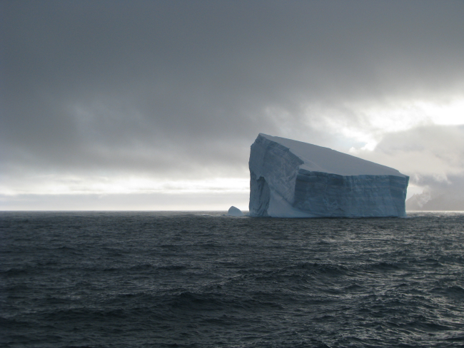 An iceberg in rough seas