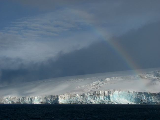 A rainbow over a glacier, South Shetland Islands, Antarctica