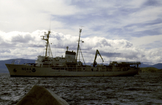 The NOAA Ship R/V Surveyor sits off the coast of Seal Island whileAMLR scientists offload supplies to the AMLR field station there
