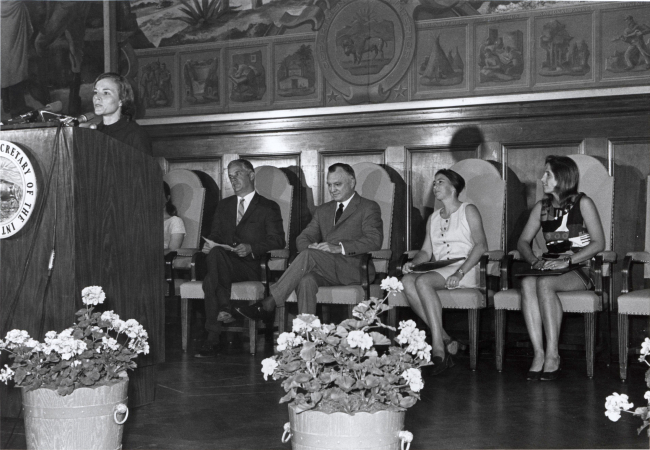 Sylvia Earle at podium during ceremony honoring women aquanauts atDepartment of the Interior