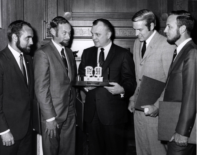Secretary of the Interior Wally Hickel with model of Tektite I and Tektite Iaquanauts