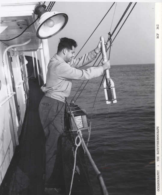 Retrieving a bathythermograph at the end of a cast off a Navy oceanographicship