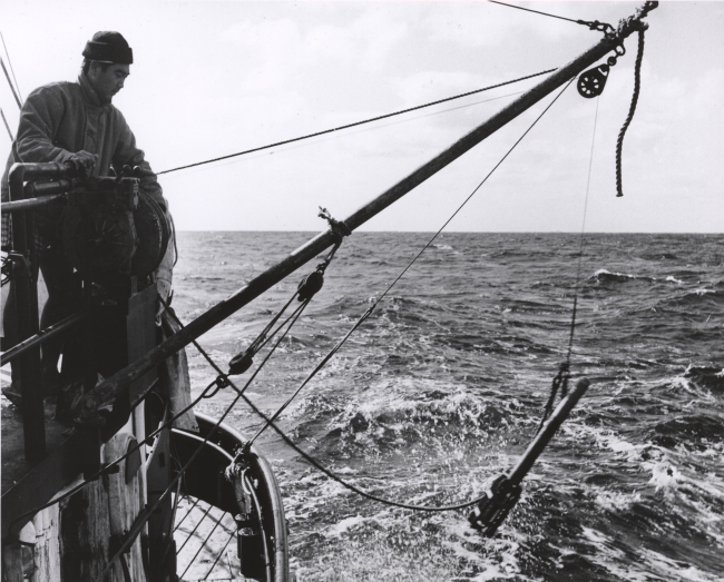 Deploying a bathythermograph from a fisheries research vessel