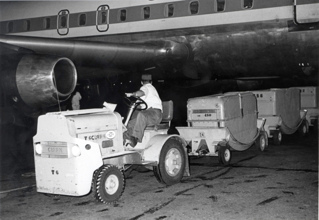 Loading fresh packed salmon in the cargo bay of a commercial airliner