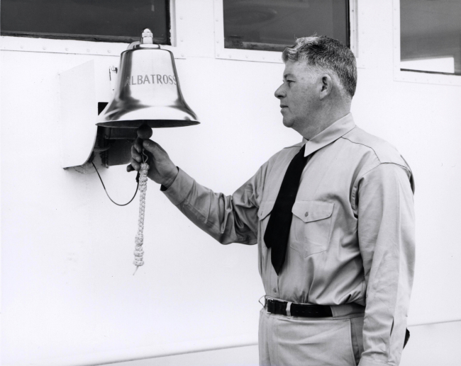 Ringing ALBATROSS IV's bell during dedication ceremony at Woods Hole