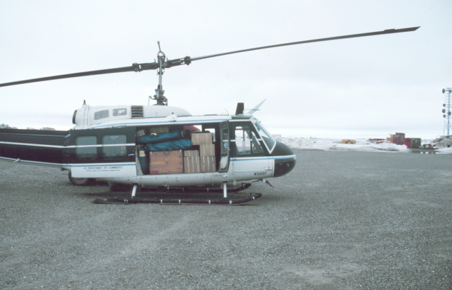 Loaded Bell UH-1M helicopter with camp gear for bird studies in the Prudhoe Bay area