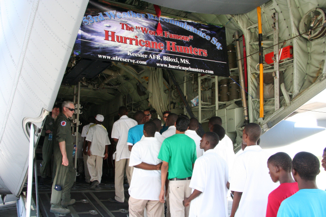 Some of the hundreds of visitors who toured the WC130-J Hurricane Hunteraircraft during its stop in Antigua in 2010 during a hurricane preparedness tour of the Caribbean