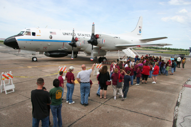 Visitors line up to board the NOAA P3 Hurricane Hunter plane during a stopin Beaumont during a Hurricane Awareness tour