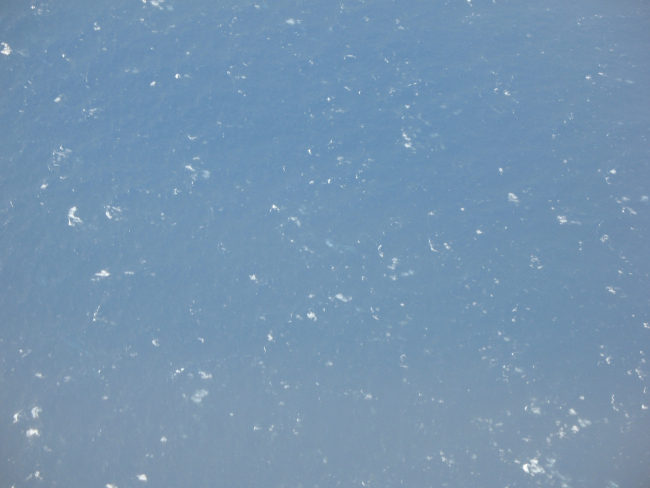 Looking down on a sea surface laced by tropical storm force winds