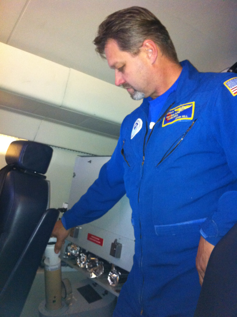 NOAA Engineer John Hill deploys a dropsonde from the G-IV during a February2013 mission over the North Pacific Ocean