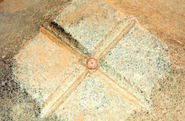 Looking down on a brass plug marking the center of the Jefferson Pier