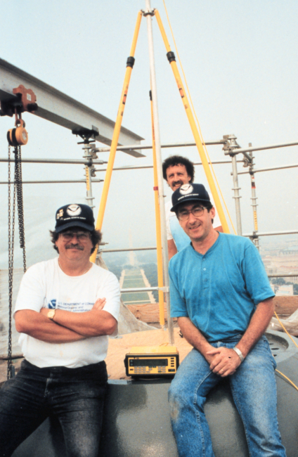 L to R - David Doyle, Roy Anderson, and Dennis Hoar are atop the CapitolBuilding during GPS surveying operations