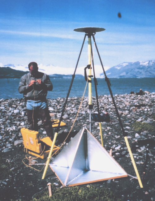 Mike Aslaksen setting up GPS antenna over radar reflector which was used forcontrolling airborne synthetic aperture radar survey