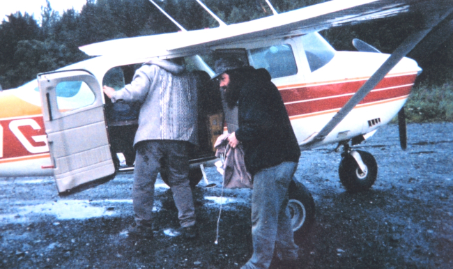Unloading gear from bush aircraft used for transportation from Yakutat