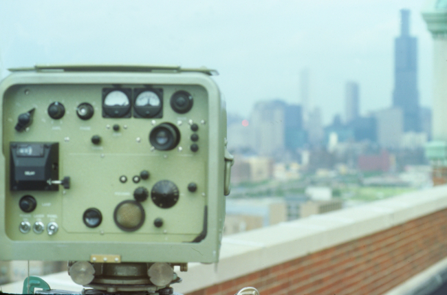 Model 8 Geodimeter measuring distances from a rooftop in Chicago