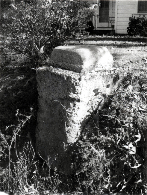 Survey mark with concrete base eroding 