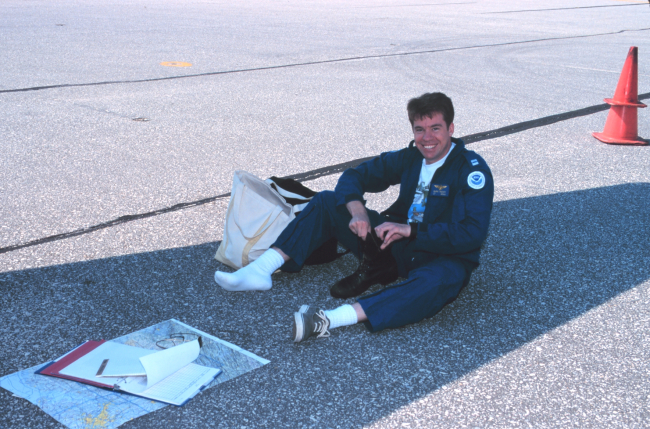 Lieutenant Mark Hickey preparing for aerial photographic mission onRockwell Turbo Commander N53RF