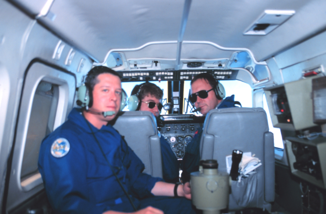 Photographer Sean Linehan in foreground with pilots Lieutenant Mark Hickey andLieutenant Commander Greg Lamontagne on Rockwell Turbo CommanderN53RF