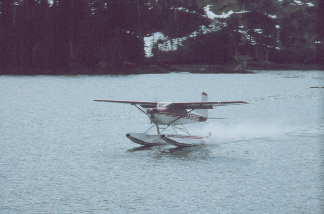 Float plane delivering parts for a heater
