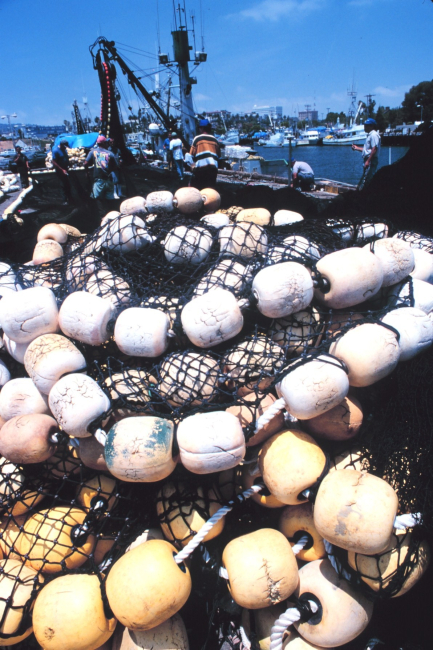 The paraphernalia of fishing on the pier - mountains of nets, floats, etc