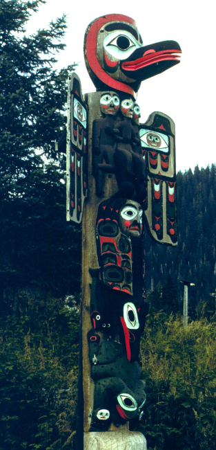Raven and Sun Totem at Saxman Totem Park outside of Ketchikan