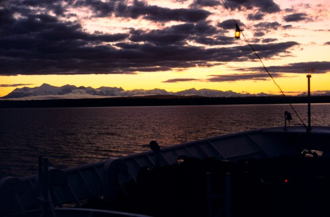 A sunset in Upper Cook Inlet taken from the bow of the FAIRWEATHER