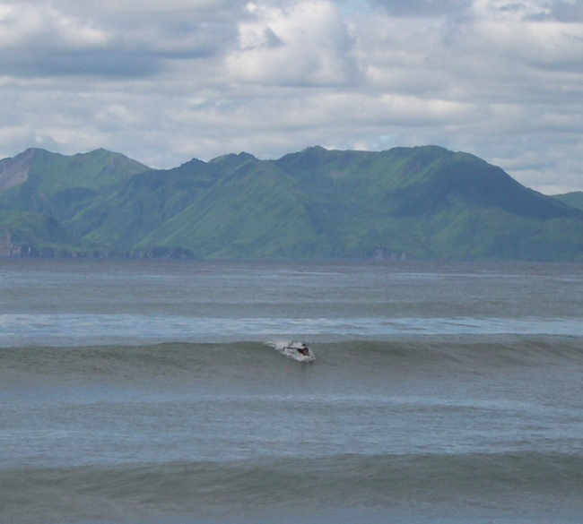 NOAA Ship RAINIER personnel surfing on Kodiak Island