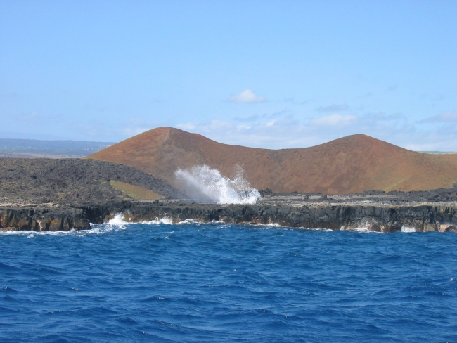 A blowhole shooting out water from the action of waves entering asubterranean passage