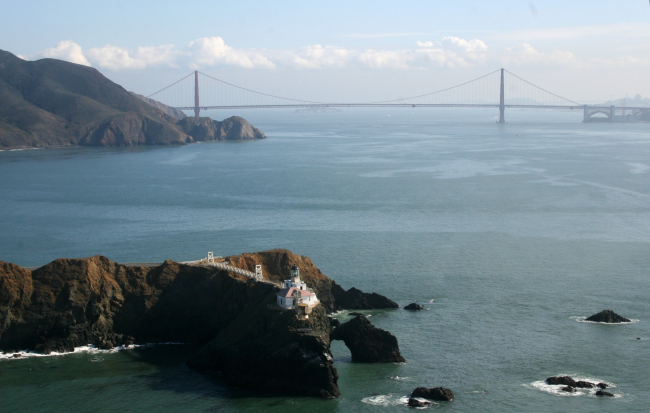 A magnificent view of the Point Bonita Lighthouse with the Golden Gate Bridge in the background