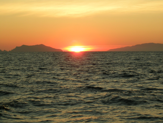 Sunset between Santa Cruz and Anacapa Islands as viewed from the contractfishery research vessel AGRESSOR