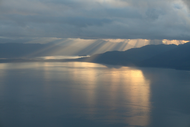 Crepuscular rays shower Chichagof Island as seen from the air