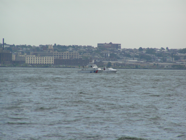 Coast Guard patrol craft inspecting pleasure craft in New York Harbor area
