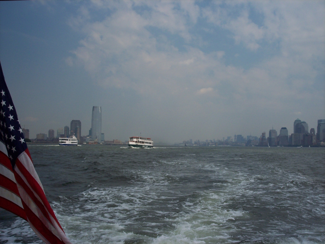 Passenger ferries passing each other with New Jersey on the left,Manhattan on the right