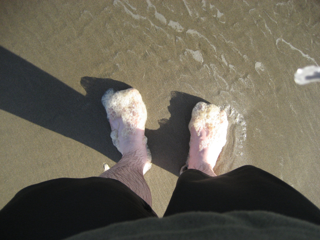 Foamy feet on the Oregon coast
