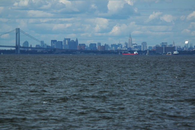 Looking over the east end of the Verrazano Narrows Bridge to Brooklyn andthe New York Manhattan skyline beyond