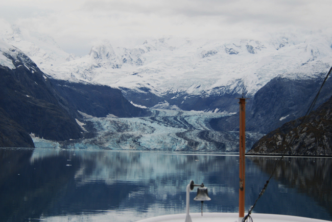 The NOAA Ship FAIRWEATHER's ships bell with Johns Hopkins Glacier in thebackground