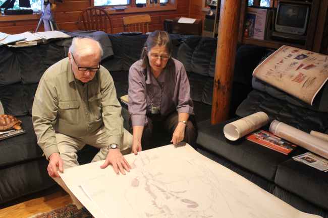 Kathy and William Ruddy, noted Alaskan historians, ethnographers, and legalauthorities, examining the Kohklux map brought by Dr