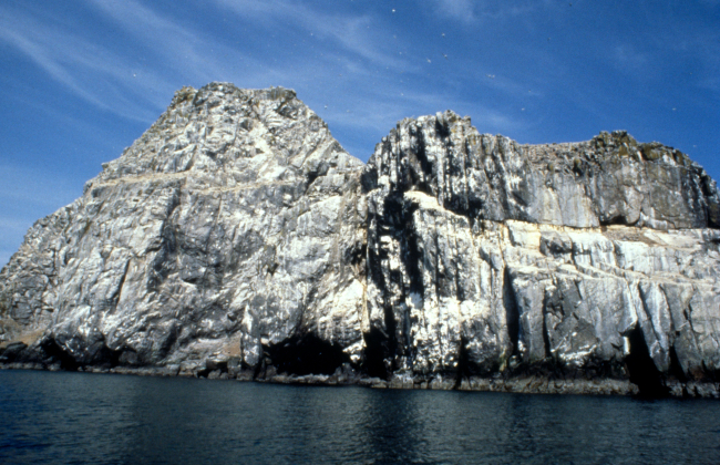 Offshore rocks covered with bird excrement