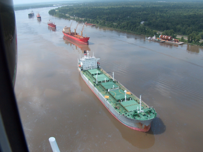 A few of the 70 or so vessels waiting to transit the Mississippi River following the collision of a fuel barge and a chemical tanker resulting in the spill of419000 gallons of oil