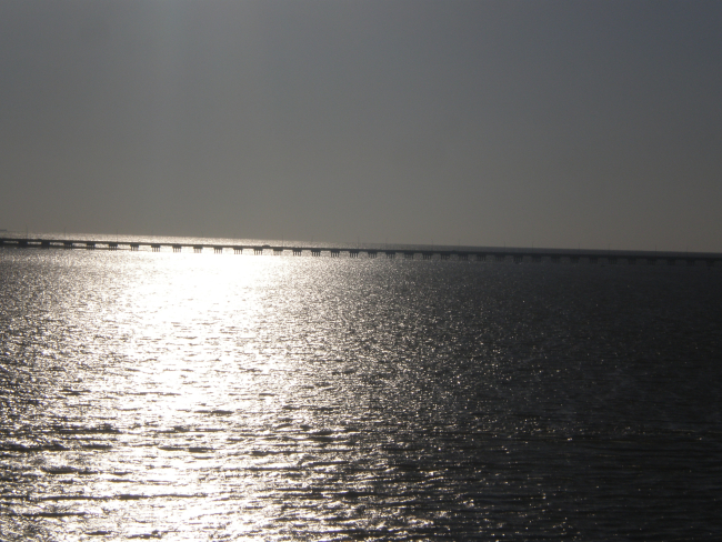 Lake Ponchartrain Causeway looking into the sunglint of late afternoon