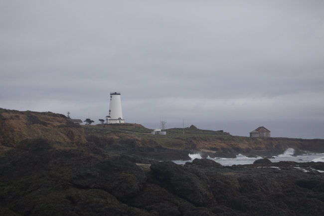 Looking to the south at the  renovated Piedras Blancas Lighthouse from therocky shoreline