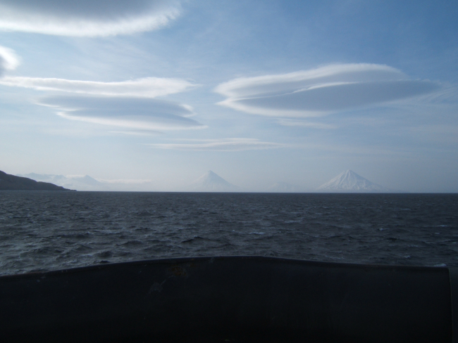 Lenticular clouds seen over the Islands of the Four Mountains