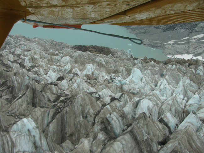Looking down on tortured surface of Hallo Glacier near its terminus